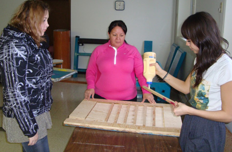 Students making a table-top press